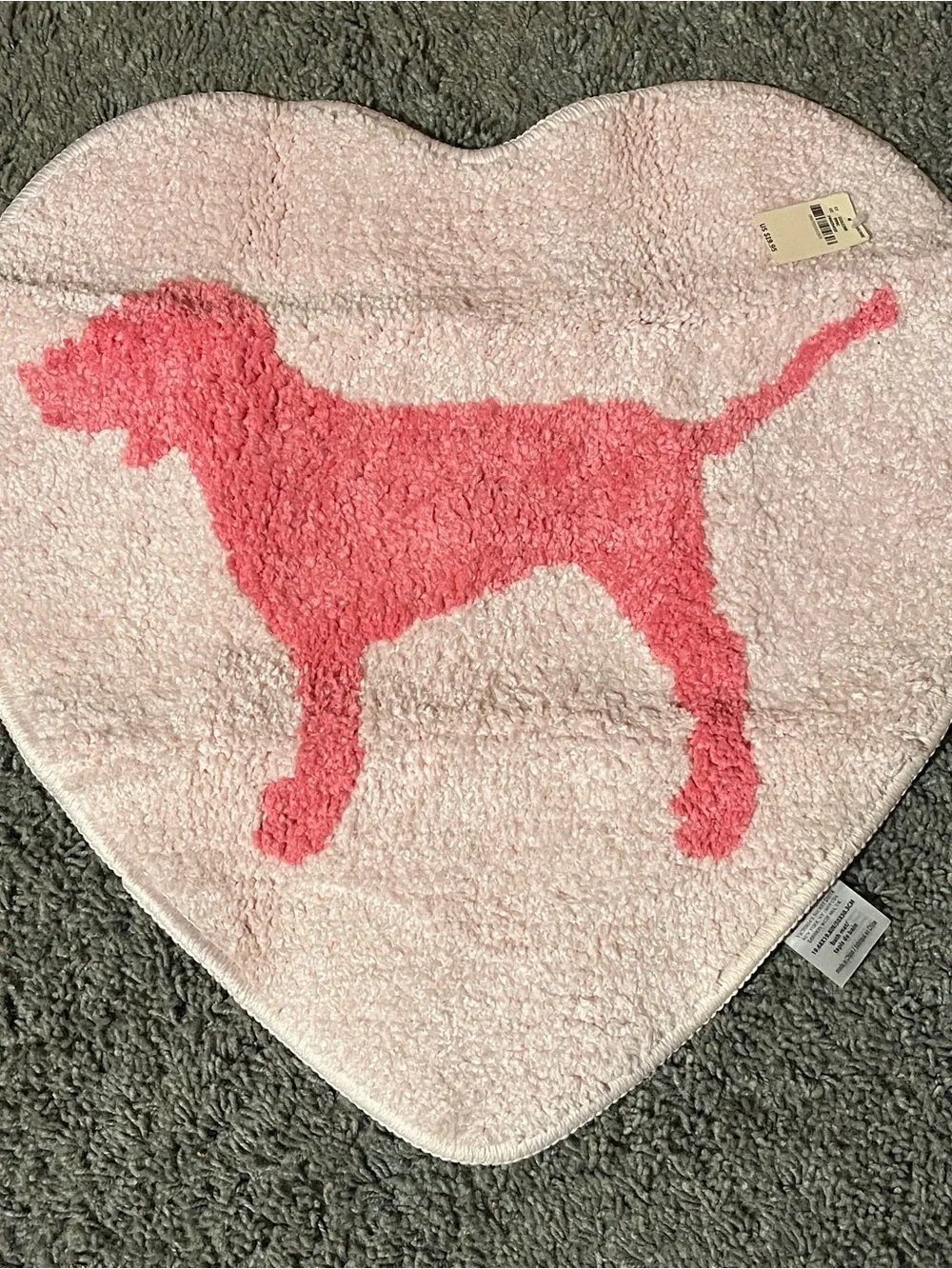 Pink Victoria’s Secret Heart bath mat with dog logo and original tags